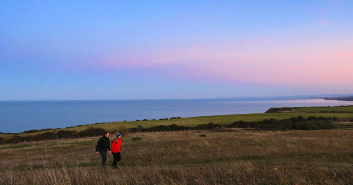 Man and woman walking along coastal footpath at Easington on Durham Heritage Coast.